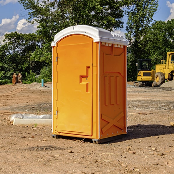 what is the cost difference between standard and deluxe portable restroom rentals in Elmer